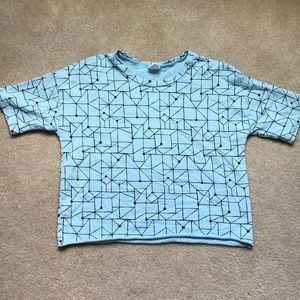 Black and blue cropped shirt.